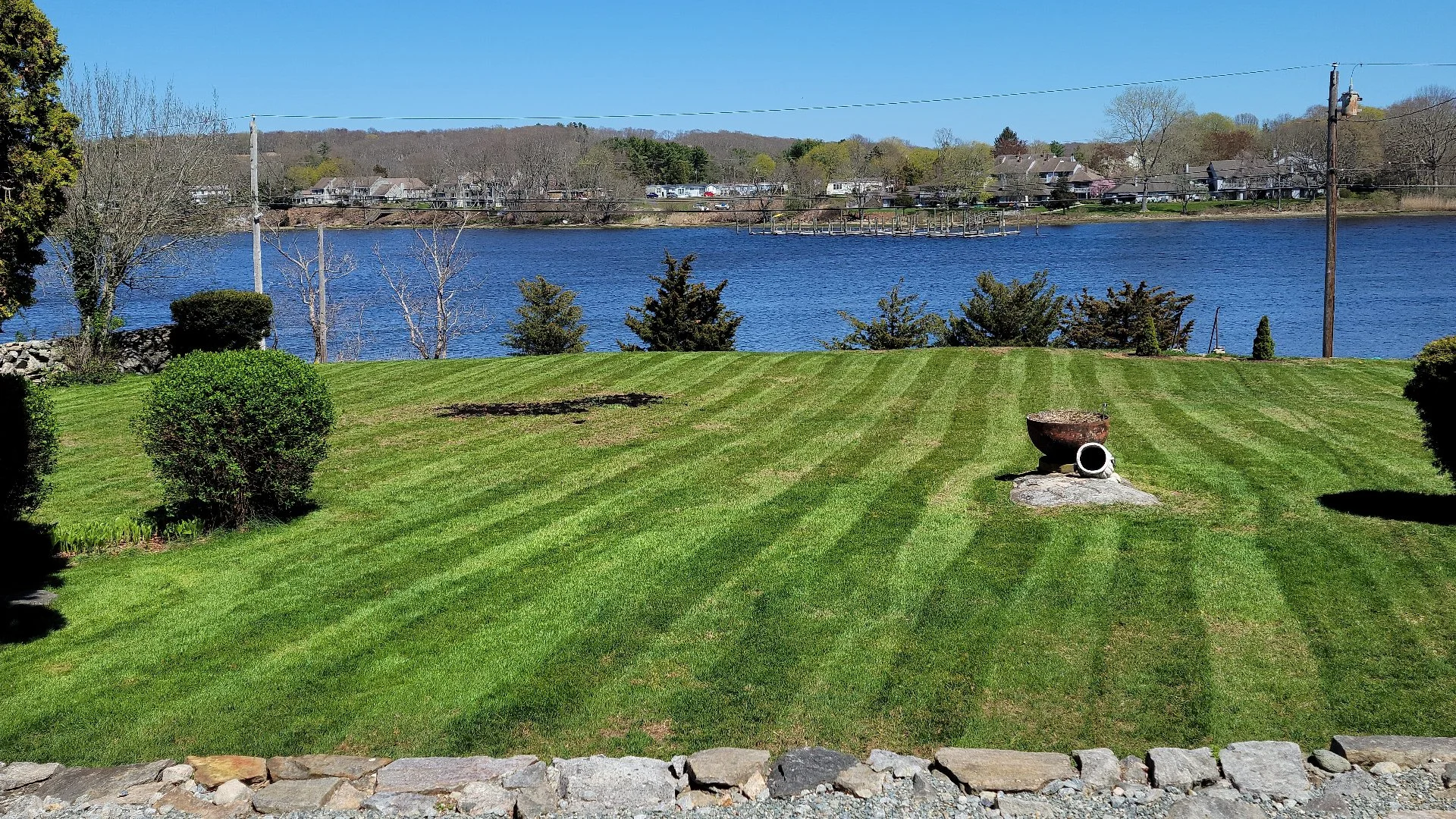 Striped lawn by a river in Groton, CT
