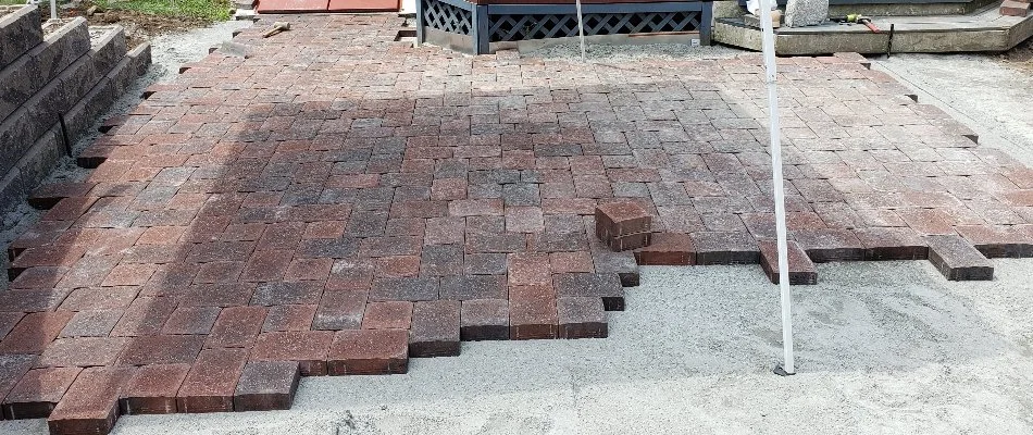 Installing pavers for a patio in Groton, CT.