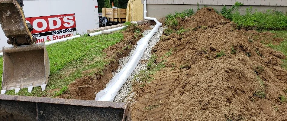 New French drain in dirt in Groton, CT.