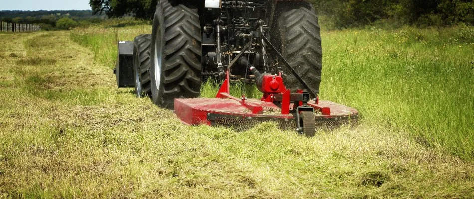 Brush hogging an overgrown field in Groton, CT.