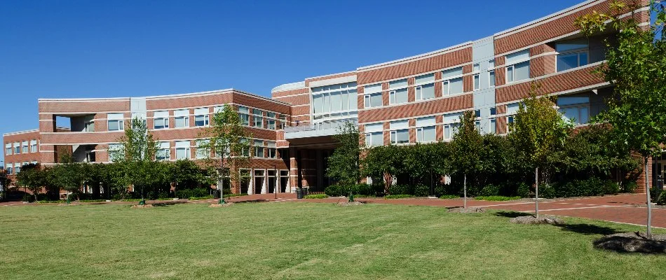 Commercial property in Gales Ferry, CT, with green trees.