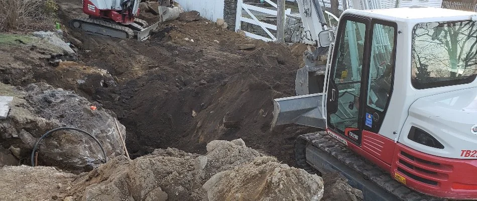 Leftover stump on a lawn after tree removal in Groton, CT.