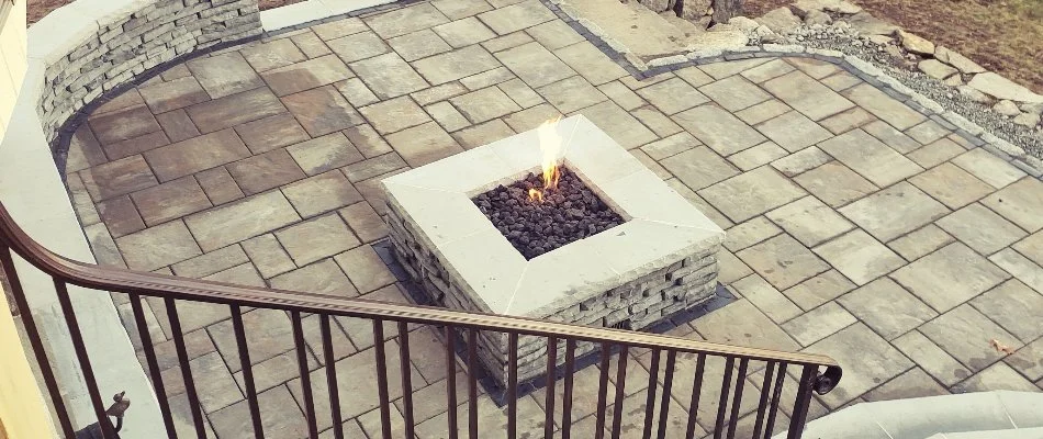 Gas burning fire pit on a patio in Groton, CT.