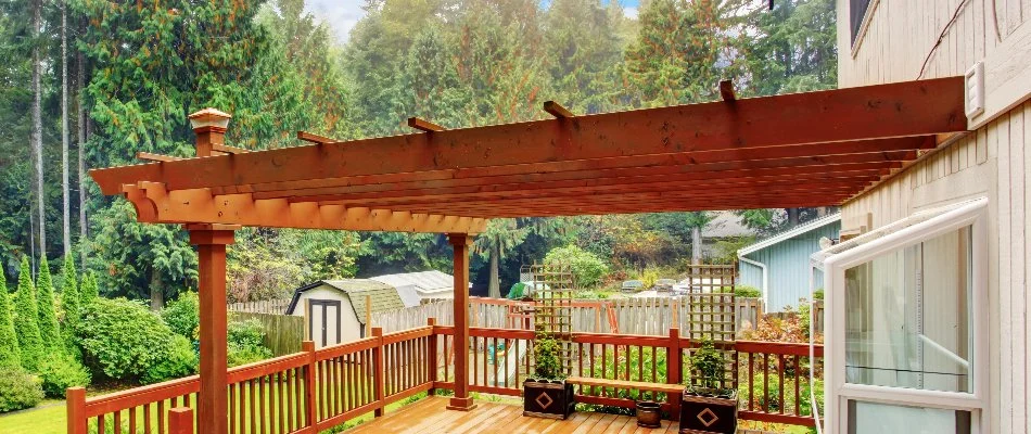 House in Groton, CT, with wooden pergola.