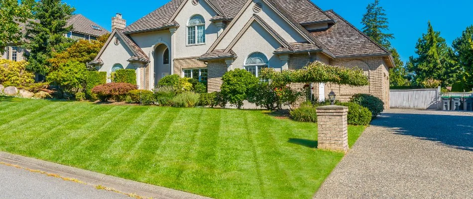 Residential property with a mowed lawn on a property in Groton, CT.