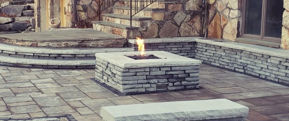 Patio in Ledyard, CT, with a gas-burning fire pit.