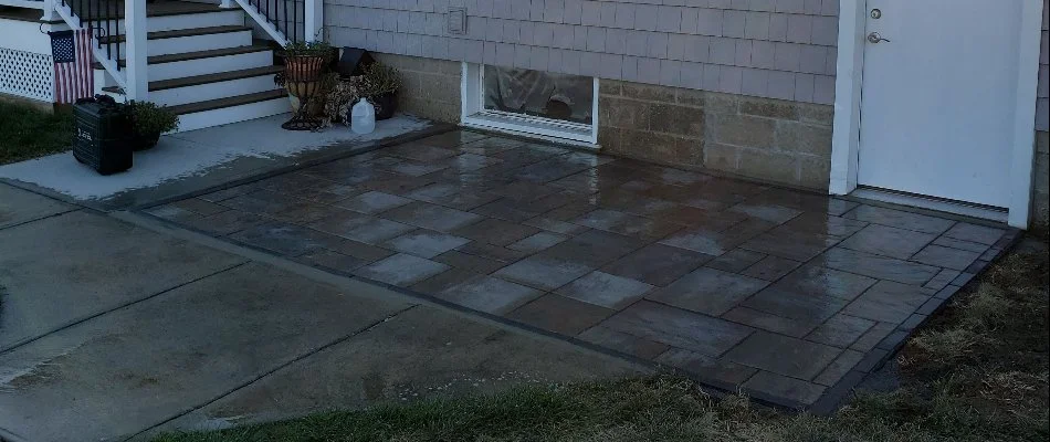 Backyard in Groton, CT, with a paver patio.
