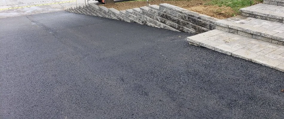 Sloped asphalt driveway in Groton, CT.