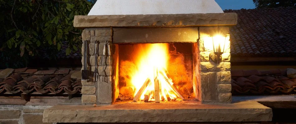 Wood-burning outdoor fireplace in Groton, CT.